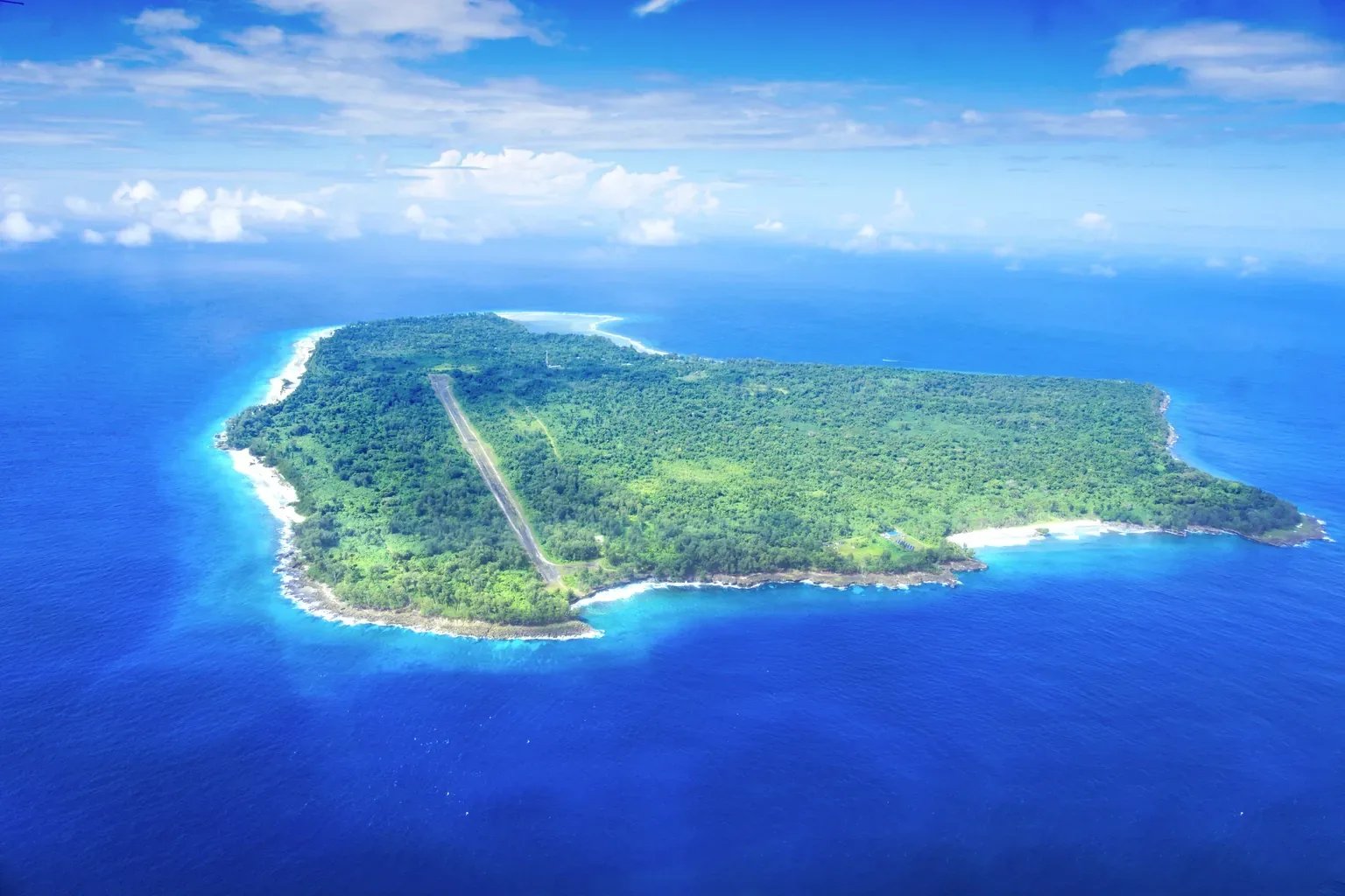 Aerial view of Angaur island surrounded by the blue Pacific